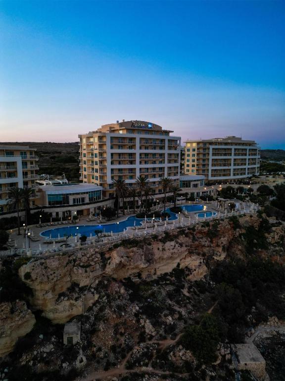 an aerial view of a resort on a cliff at Radisson Blu Resort & Spa, Malta Golden Sands in Mellieħa