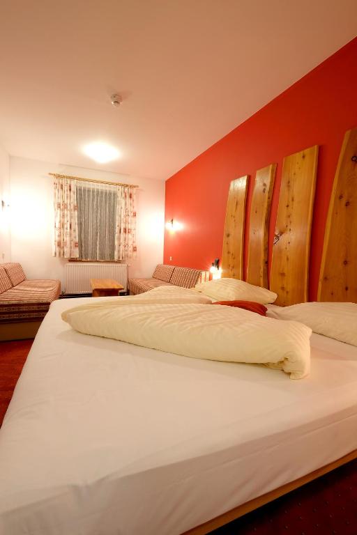 Postel nebo postele na pokoji v ubytování Alpenhotel Marcius