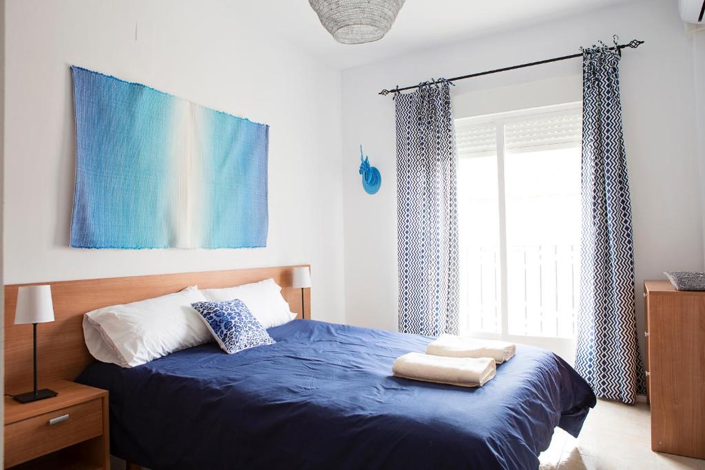 Posteľ alebo postele v izbe v ubytovaní Hello Málaga Flat Delicias