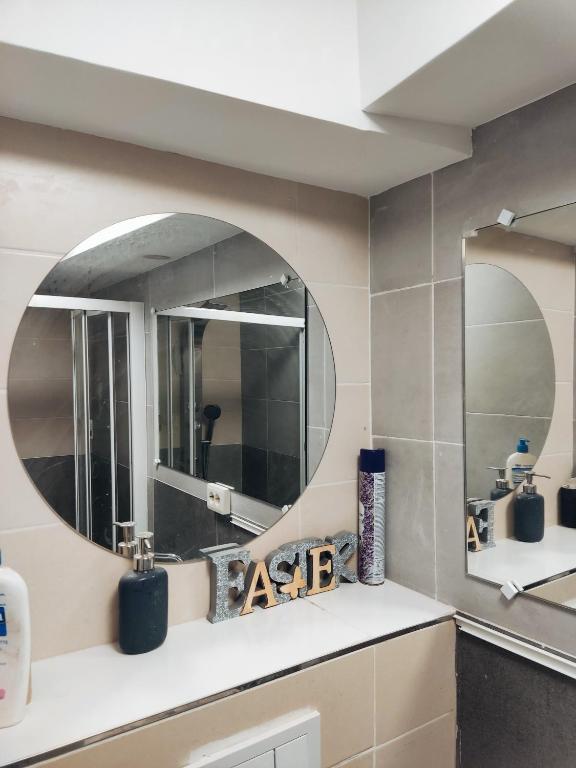a bathroom with a sink and a mirror at Chambre d'hôte à Wiltz in Wiltz