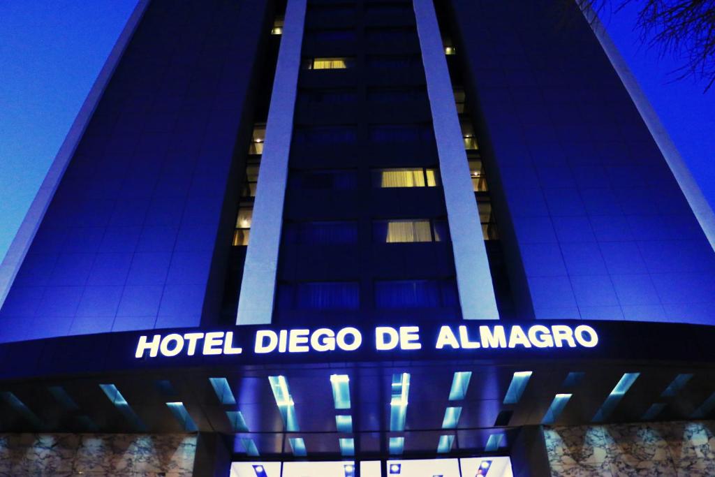 a blue and white building with a sign on it at Hotel Diego de Almagro Providencia in Santiago