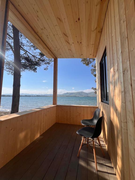 a cabin with a view of the water at Sevan Resort No5 in Chʼkalovka