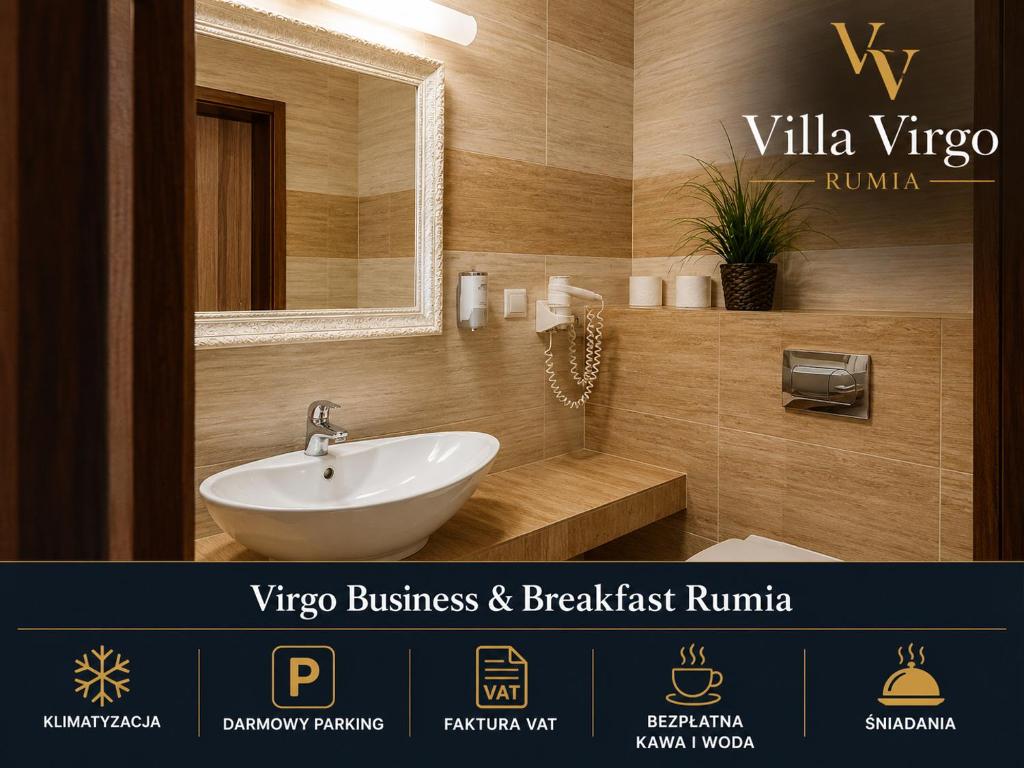 a bathroom with a sink and a mirror at Virgo Business & Breakfast Rumia in Rumia