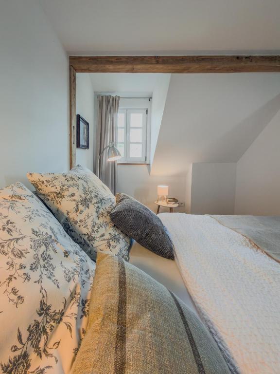 a bedroom with a bed with pillows on it at An der Obstwiese in Untergut