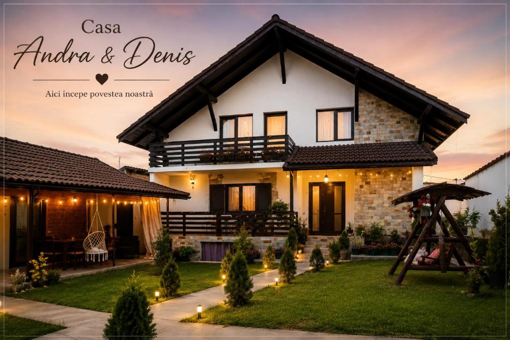 a house with lights in front of it at Casa Andra si Denis in Novaci-Străini