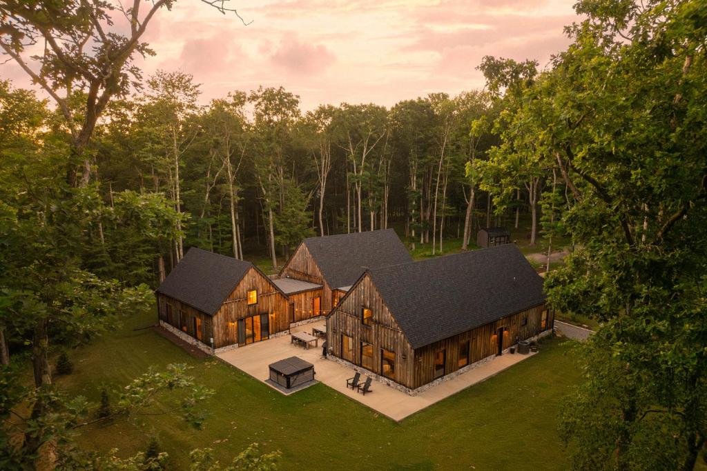 an aerial view of a large house in the woods at Deep Creek Modern by Railey Vacations in Oakland