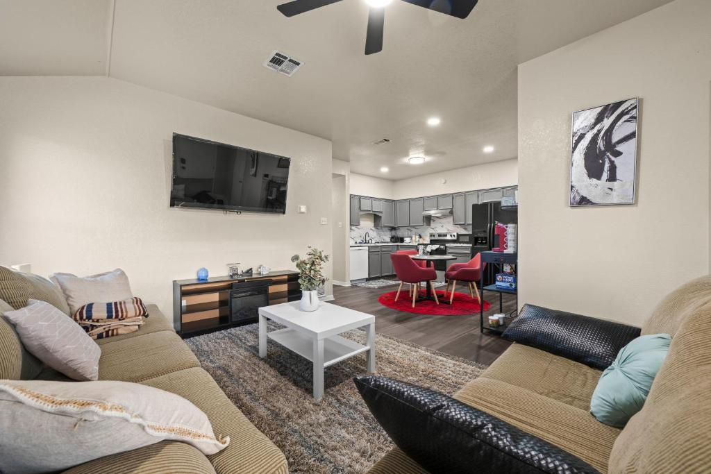 a living room with a couch and a table at Urban Loft in Killeen