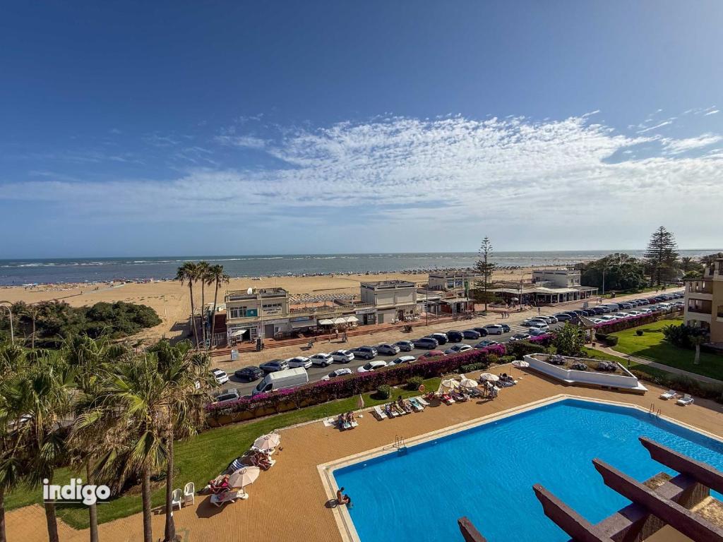an aerial view of a resort with a swimming pool and the beach at Beachfront Apartment - Sea View - COU02 in Ayamonte