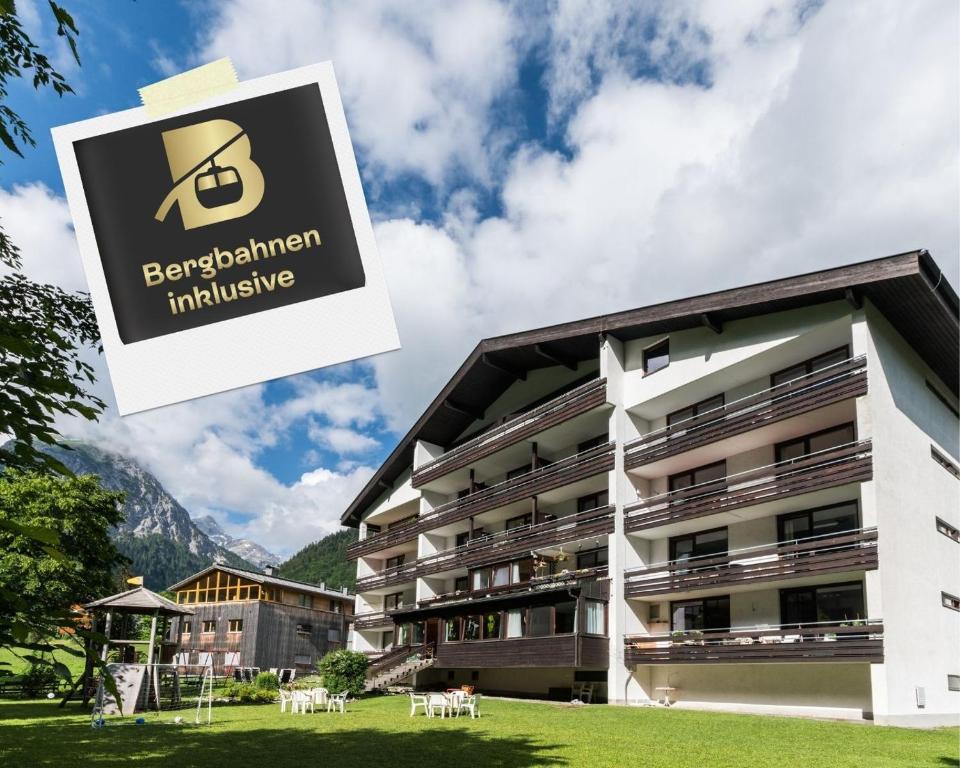 a building with a sign that reads berliner influencing at Appartement Haus Zalim in Brand