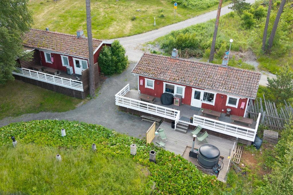 an aerial view of a house and a yard at Airisto Hill & Inn - Two Beach Cabins in Haverö
