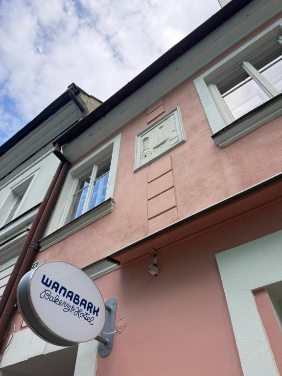 a building with a sign on the side of it at WanaBark Hotel - The Ultimate Dogs-friendly Spot in Bratislava in Bratislava