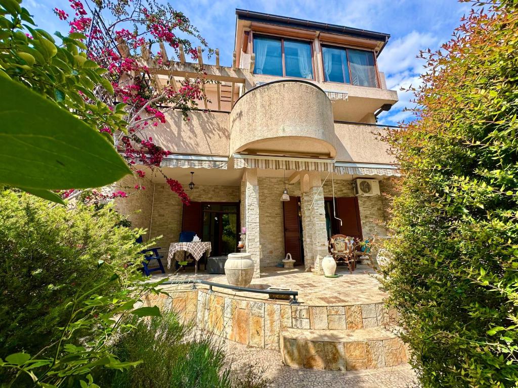 a large house with a large window on top of it at Villa Leo in Bar