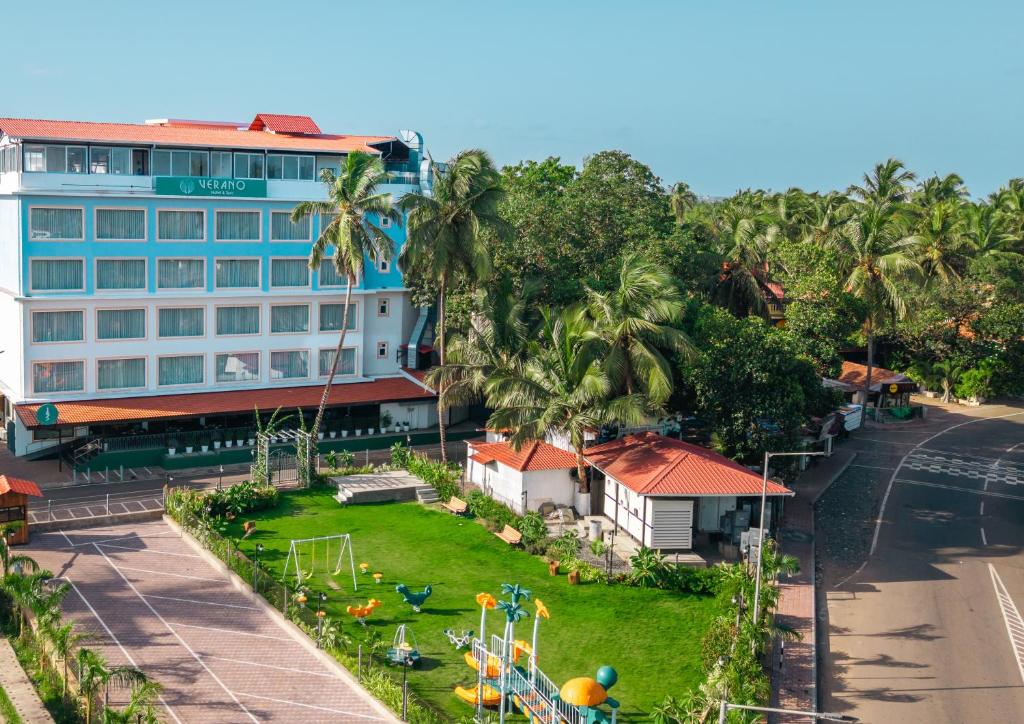 an aerial view of a hotel with a playground at Verano Hotel & Spa Arpora Goa in Arpora
