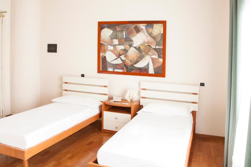 Posteľ alebo postele v izbe v ubytovaní Blu Hotel