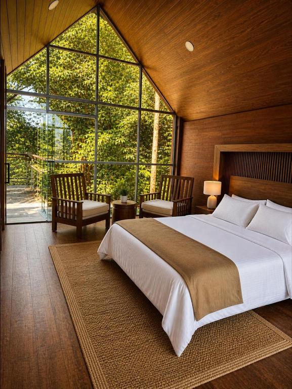 a bedroom with a large bed and a large window at Chamanica in Coroico