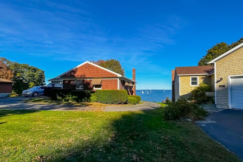 a house with a view of the water at Waterfront home with beautiful bay views - near shops & dining in Owls Head