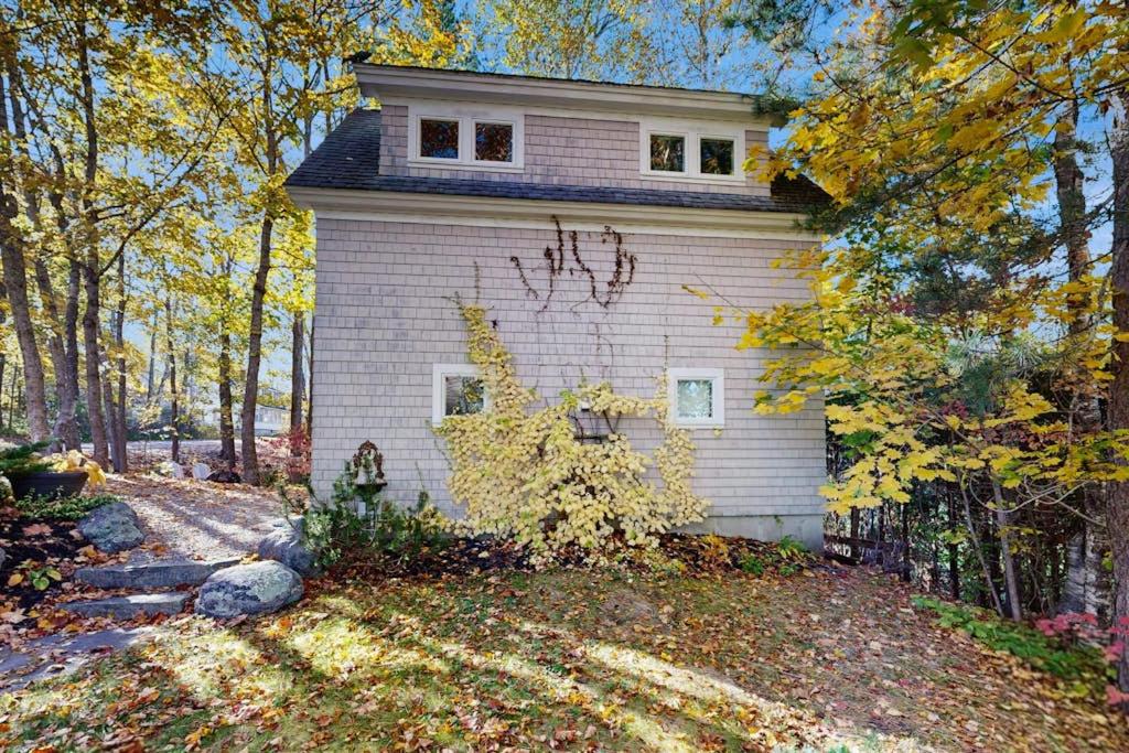a house with graffiti on the side of it at Charming coastal cottage with firepit and easy beach access in Rockport