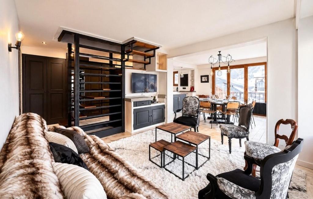 a living room with a couch and chairs and a table at L'Ecrin de Jade - Valloire in Valloire
