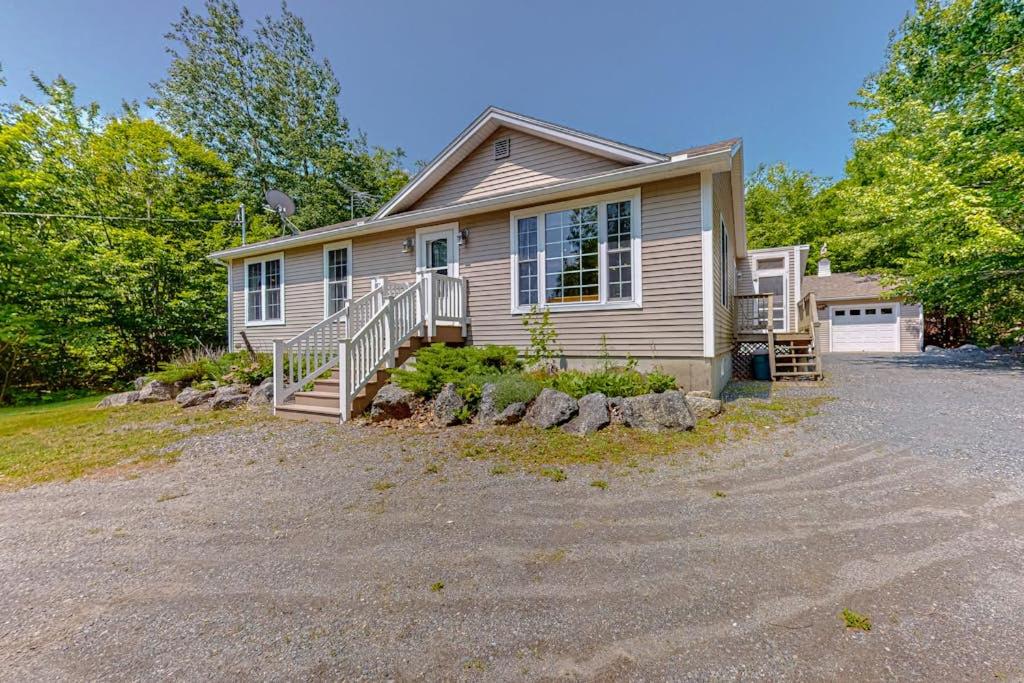 a house with a driveway in front of it at Inviting dog-friendly home with firepit & Ping-Pong - near Acadia National Park in Ellsworth