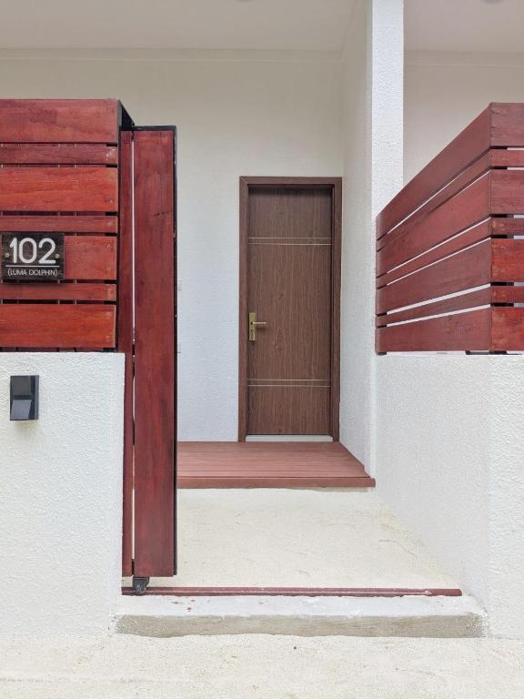 an open door of a building with a wooden door at Luma Boutique Hotel Omadhoo in Omadhoo