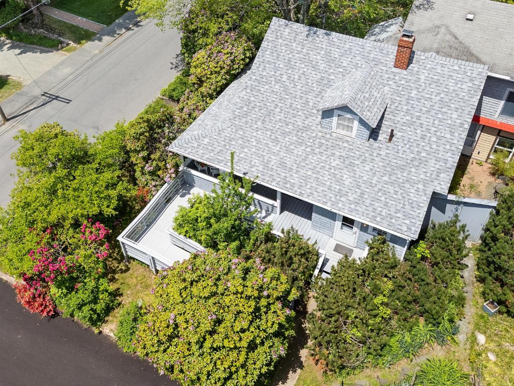 an overhead view of a house with a roof at Bright, spacious getaway with full kitchen, furnished porch & WiFi - near trails in Seal Harbor