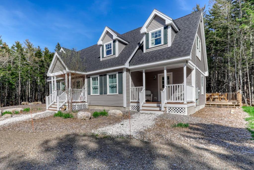 a house in the woods with a yard at Secluded Dog-Friendly Getaway w/ Free WiFi, Private Washer/Dryer, Furnished Deck in Southport
