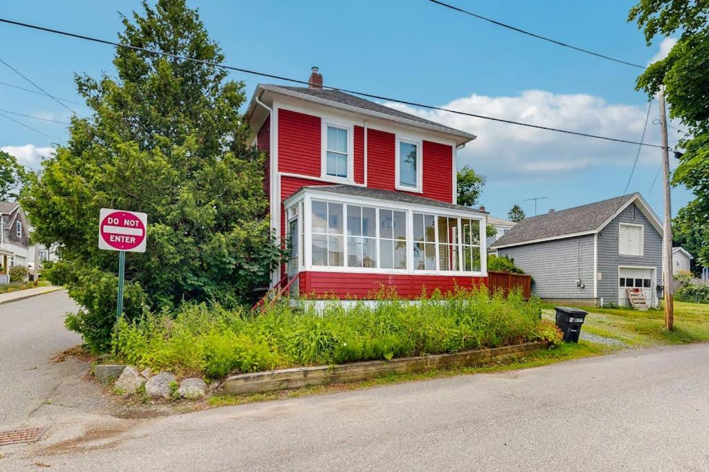 a red house on a street with a do not enter sign at Dog-Friendly House with WiFi and Deck - Near the Water, Eateries, and Shopping in Bar Harbor