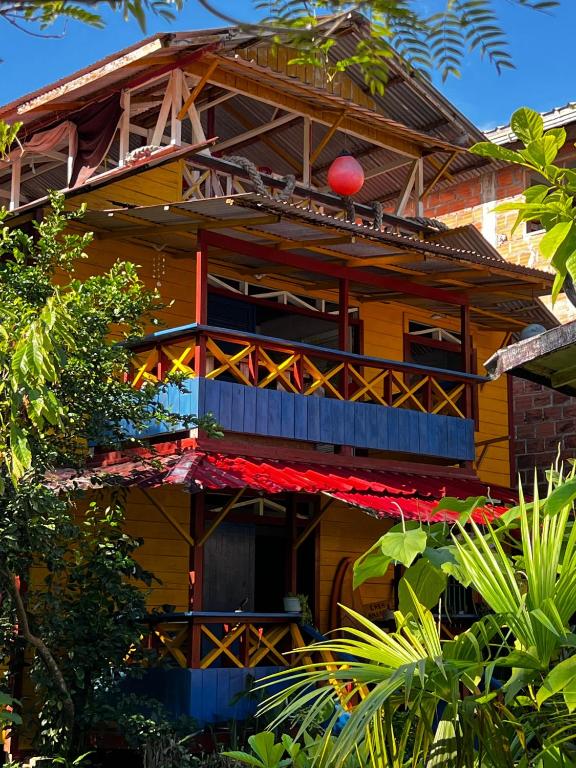 a house with a red ball on top of it at Casa Hostal Amar-illa in El Valle