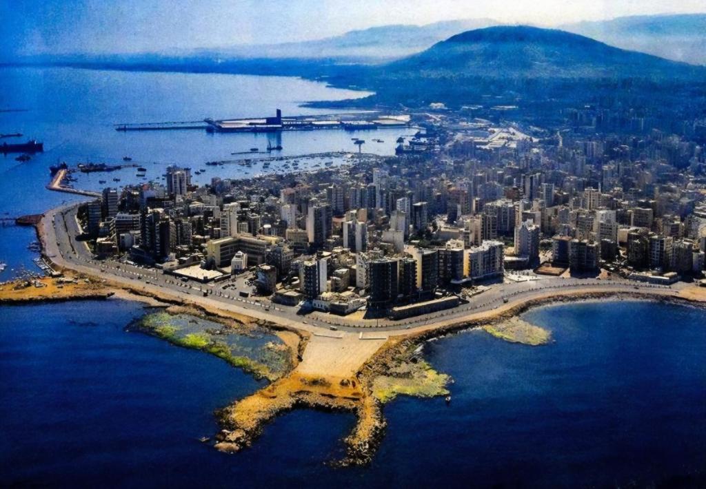 an aerial view of a city in the water at Sea promenade Hostel Art Apartment in El Mîna