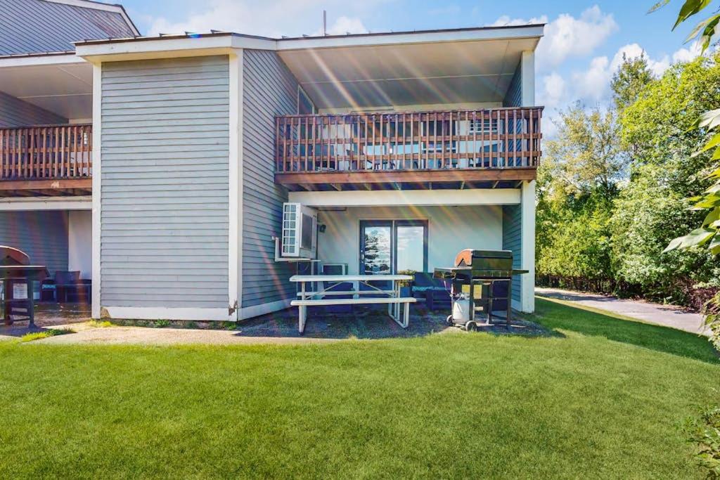 a house with a deck and a picnic table and a grill at Family & Dog-Friendly Townhouse w/Back Porch, Views, Partial AC in Bar Harbor