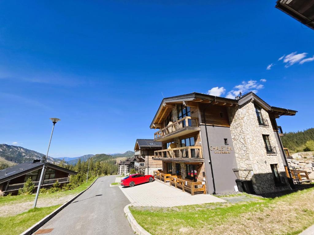 a house on the side of a road at ChaletSKI Jasná, SKI-IN & SKI-OUT in Belá