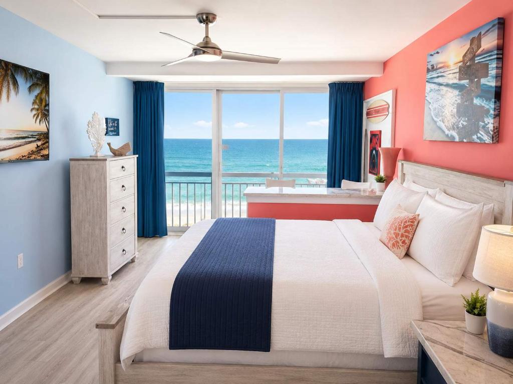 a bedroom with a bed with a view of the ocean at Updated Oceanfront Suite by Skywheel Yachtsman 902 in Myrtle Beach