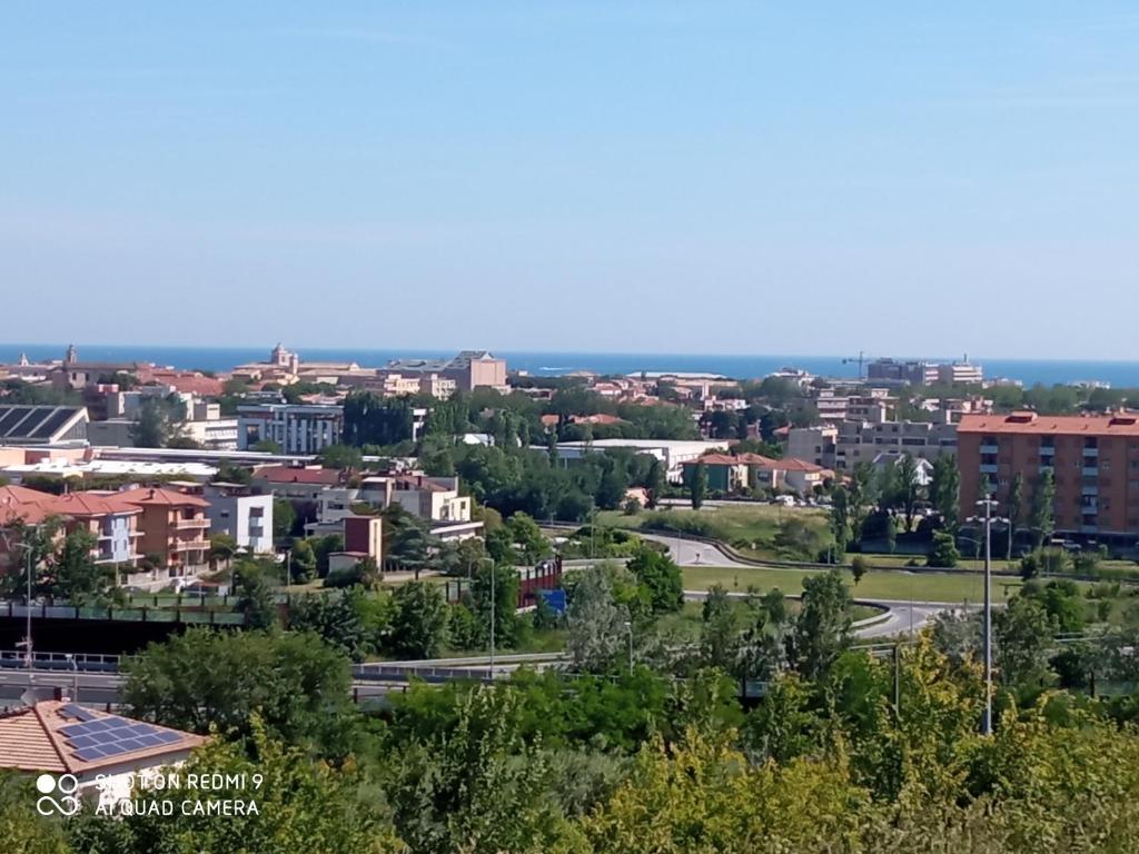 a view of a city with buildings and trees at Casa Panorama in Senigallia