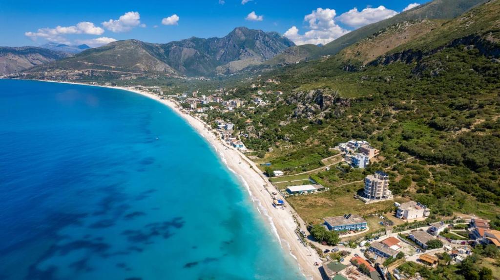 an aerial view of the beach and the ocean at Nefeli apartments in Borsh