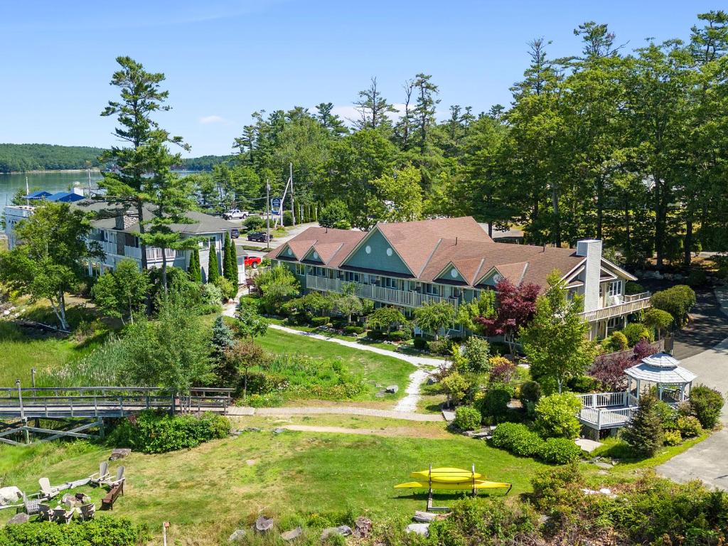 an aerial view of a resort with a yellow kayak at Mabel's Maine Studio on the River in Edgecomb