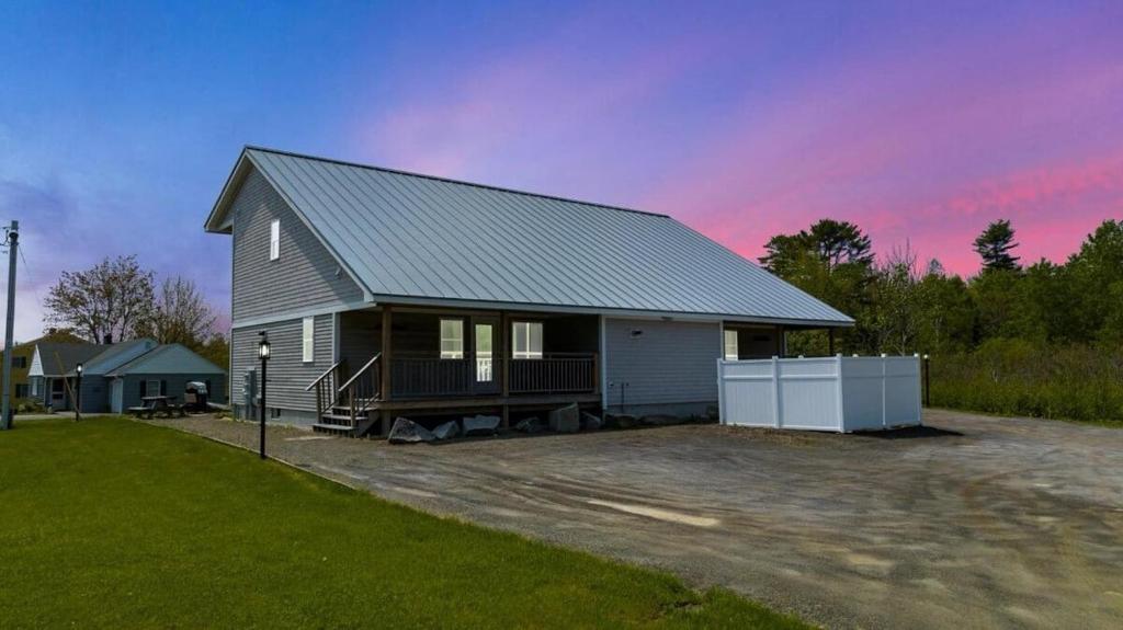 a small house with a driveway in front of it at Ocean Breeze West Wind – Updated 2BR/2BA home step in Owls Head