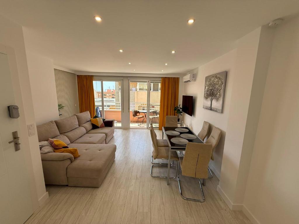 a living room with a couch and a table at Bella Apartment Playa Del Cura in Torrevieja