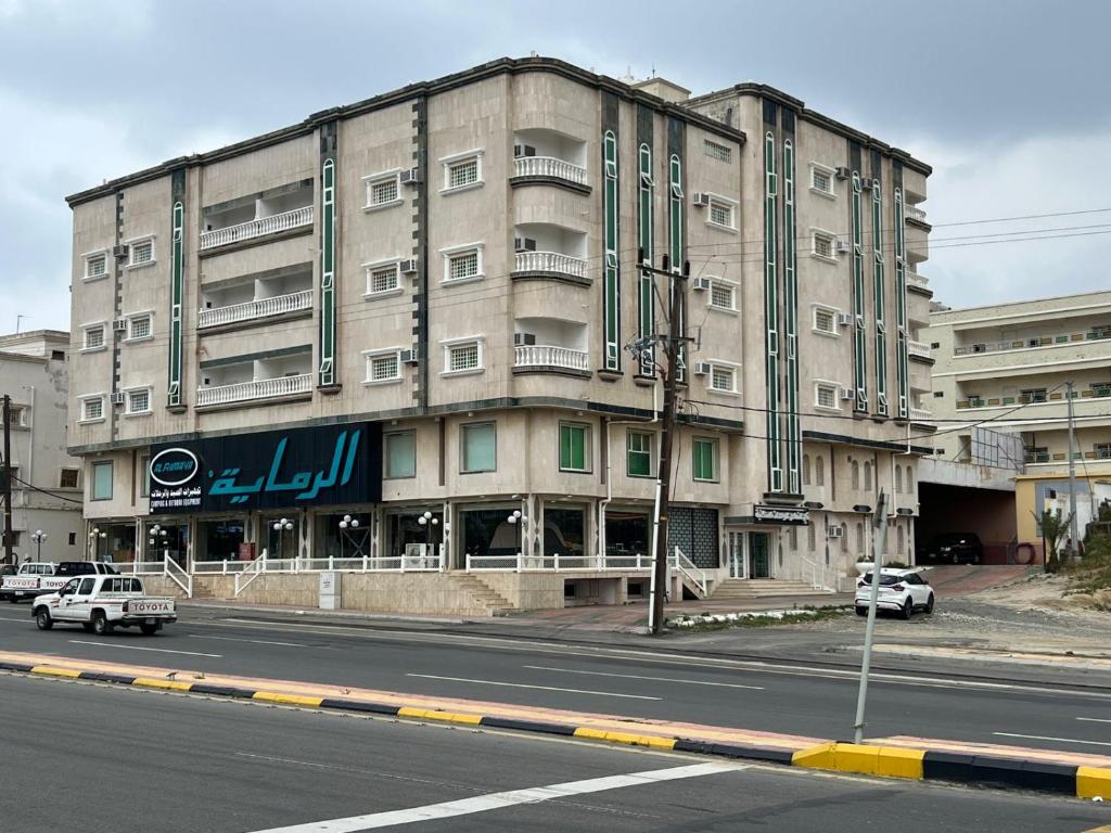 a large building on the side of a street at ريف سويت للشقق المخدومة in Al Namas