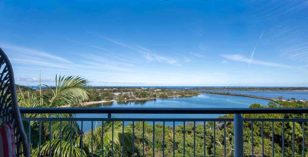 a view of a river from a balcony at Lazy Days Penthouse - Opposite Shaws Bay - 180 Waterfront Views in East Ballina
