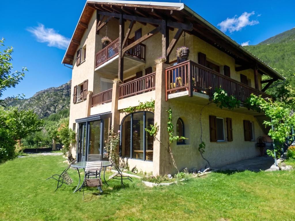 a large house with a balcony on the side of it at Appartement paisible à Saint-Crepin avec vue sur la montagne in Saint-Crépin