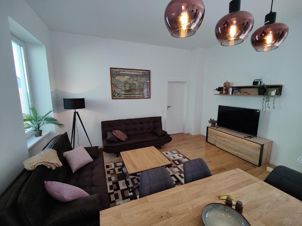 a living room with a couch and a table at Apartment Felicitas FEE in Tulln