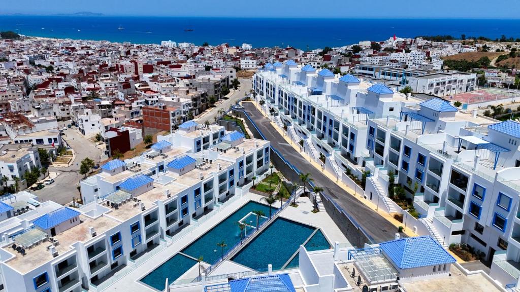 an aerial view of a building with a swimming pool at Résidence Oscar - Pool & View in M'diq