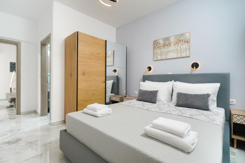 a bedroom with a large bed with white pillows at Lumina House Panagia in Panagia