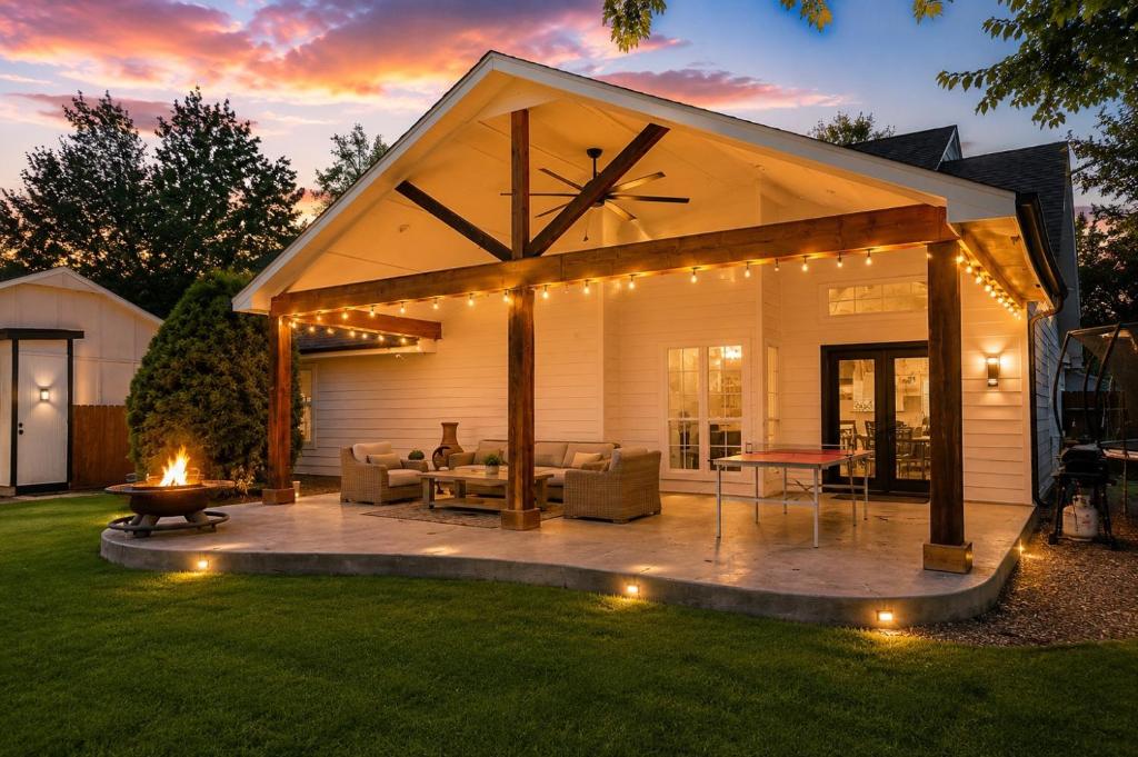 a backyard patio with a pavilion with lights on it at Casa Blanca Luxury Spa Suite with fireplace, Disc Golf, 5 beds in Tulsa