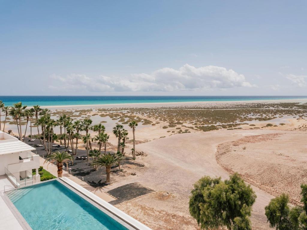 an aerial view of a resort with a swimming pool and the beach at Zel Fuerteventura in Costa Calma