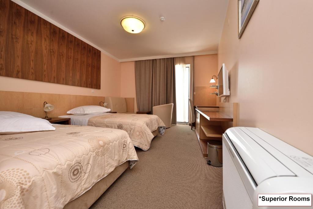 Postel nebo postele na pokoji v ubytování Hotel Joso