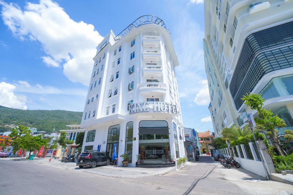 a white building on the side of a street at King Hotel in Quy Nhon