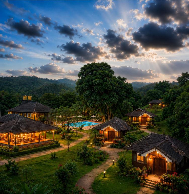 an aerial view of a resort with a pool at Sterling Kadumane Hills Sakleshpur in Sakleshpur