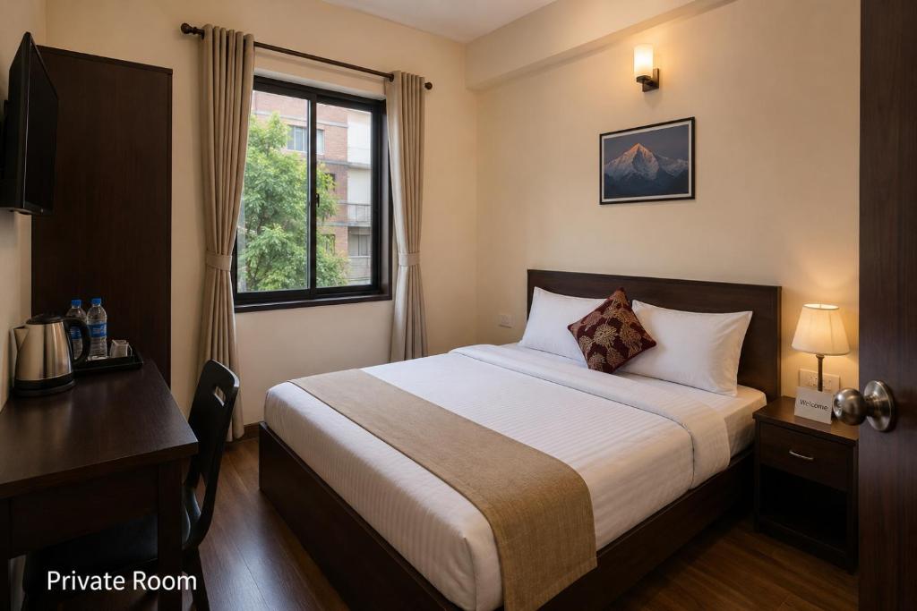 a bedroom with a bed and a desk and a window at The Desire Delhi in New Delhi