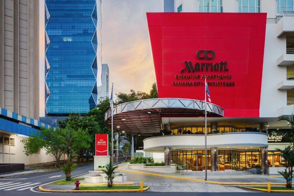 a building with a red sign on the side of it at Marriott Executive Apartments Panama City, Finisterre in Panama City